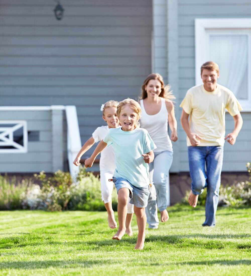 Happy family that is enjoying their home after an annual maintenance inspection Happy family that is enjoying their home after an annual maintenance inspection